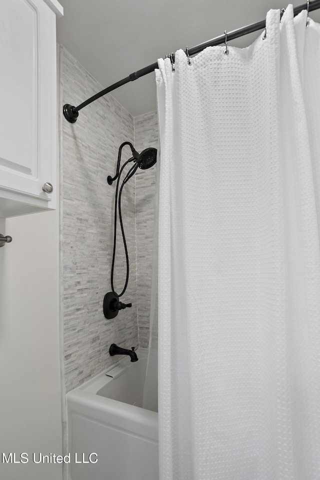 full bathroom with shower / bathtub combination with curtain