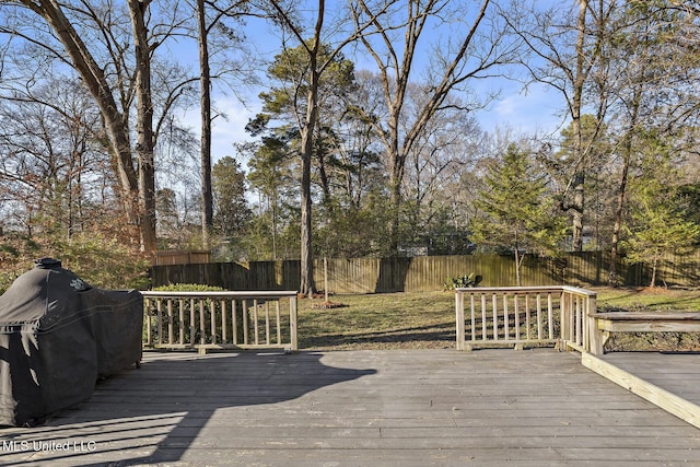 deck with a fenced backyard