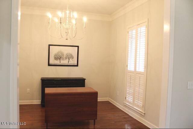 hall with ornamental molding, dark hardwood / wood-style floors, and a chandelier