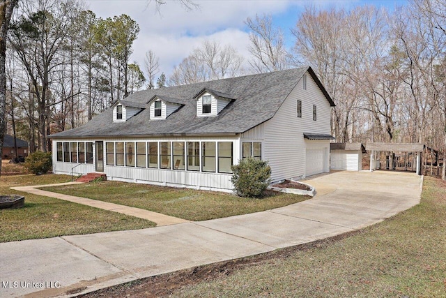 view of front of home featuring a front yard and a sunroom