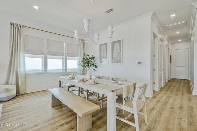 26470 W Beach Blvd, Pass Christian, MS 39571 - dining room with crown molding, light wood-style flooring, a chandelier, and recessed lighting