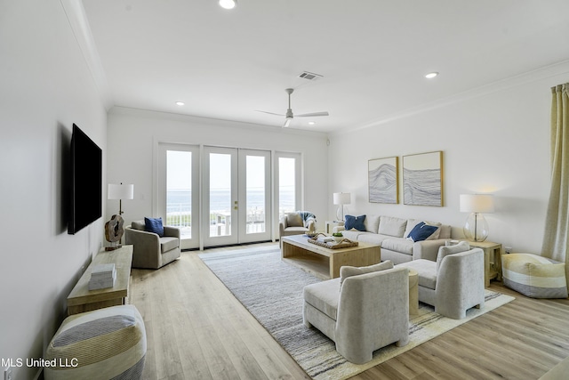 26470 W Beach Blvd, Pass Christian, MS 39571 - living room featuring crown molding, french doors, ceiling fan, wood finished floors, and recessed lighting
