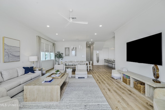 26470 W Beach Blvd, Pass Christian, MS 39571 - living area with ceiling fan, wood finished floors, ornamental molding, and recessed lighting