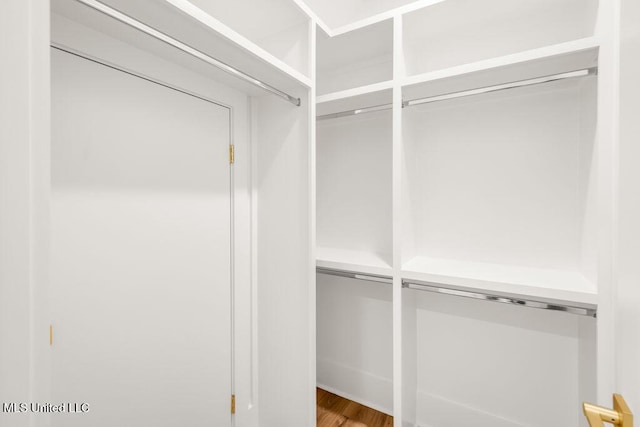 26470 W Beach Blvd, Pass Christian, MS 39571 - spacious closet featuring wood finished floors