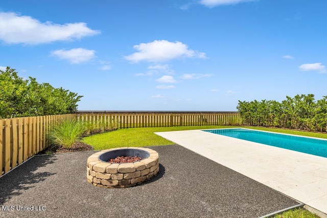 26470 W Beach Blvd, Pass Christian, MS 39571 - view of pool featuring a patio area, an outdoor fire pit, and a fenced backyard