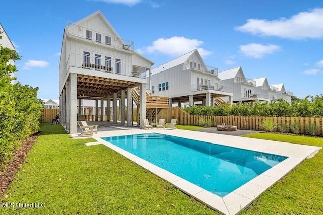 26470 W Beach Blvd, Pass Christian, MS 39571 - view of pool featuring an outdoor fire pit, a patio, a fenced backyard, and a residential view
