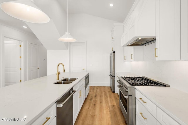 26470 W Beach Blvd, Pass Christian, MS 39571 - kitchen featuring high quality appliances, recessed lighting, light wood finished floors, white cabinets, and custom exhaust hood