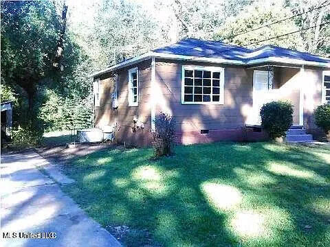 2931 Barwood Dr, Jackson, MS 39212 - view of side of property featuring crawl space and a yard