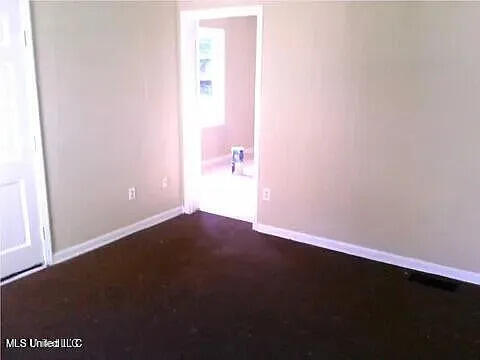 2931 Barwood Dr, Jackson, MS 39212 - unfurnished room featuring baseboards