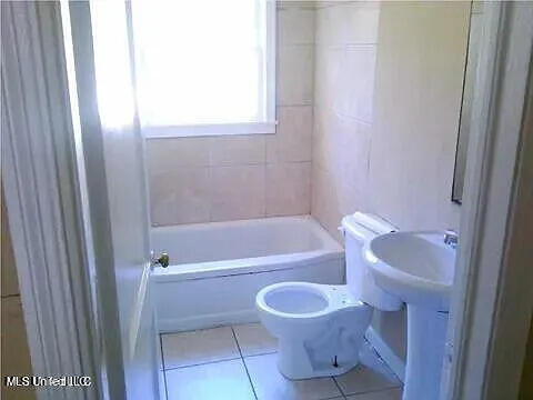 2931 Barwood Dr, Jackson, MS 39212 - full bathroom with tile patterned floors and bathing tub / shower combination