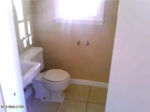 2931 Barwood Dr, Jackson, MS 39212 - bathroom featuring tile patterned flooring and toilet