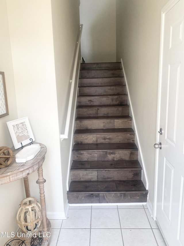 2252 Beach Dr Unit 203, Gulfport, MS 39507 - stairway featuring tile patterned flooring and baseboards