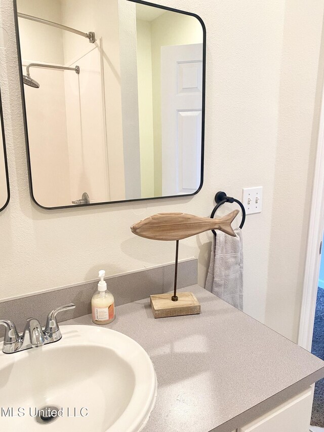 2252 Beach Dr Unit 203, Gulfport, MS 39507 - full bathroom featuring vanity and a shower