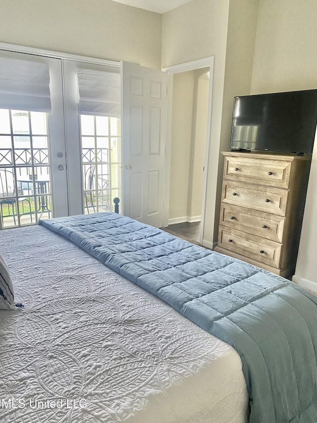 2252 Beach Dr Unit 203, Gulfport, MS 39507 - bedroom featuring access to exterior and baseboards