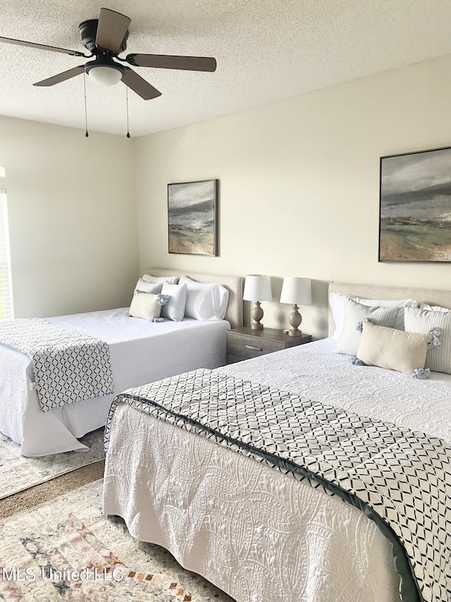 2252 Beach Dr Unit 203, Gulfport, MS 39507 - bedroom featuring a ceiling fan and carpet flooring