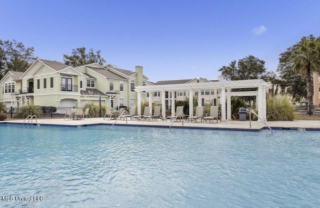 2252 Beach Dr Unit 203, Gulfport, MS 39507 - community pool with a pergola, a grill, and a patio