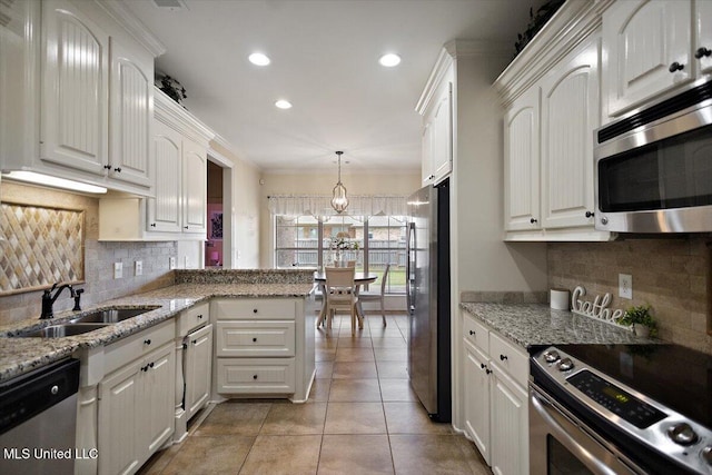 kitchen featuring a sink, white cabinetry, and stainless steel appliances