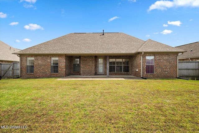 back of property featuring brick siding, a fenced backyard, and a patio area