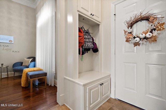 mudroom featuring ornamental molding and wood finished floors