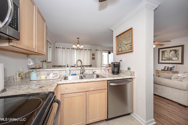 3230 Cumberland Rd Unit 18, Ocean Springs, MS 39564 - kitchen featuring ornamental molding, light brown cabinetry, ceiling fan with notable chandelier, a sink, and appliances with stainless steel finishes