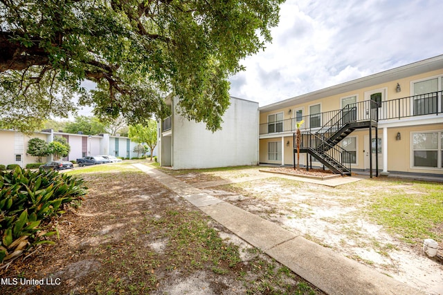 3230 Cumberland Rd Unit 18, Ocean Springs, MS 39564 - exterior space with stairs and stucco siding