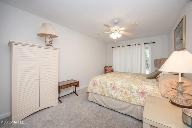 3230 Cumberland Rd Unit 18, Ocean Springs, MS 39564 - carpeted bedroom with baseboards, a ceiling fan, and a closet