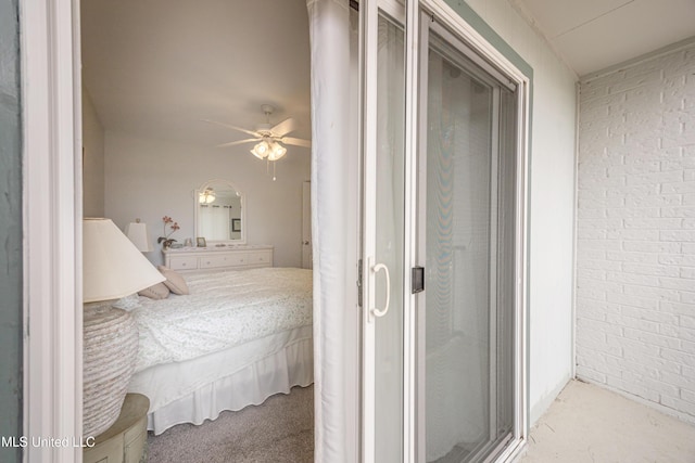 3230 Cumberland Rd Unit 18, Ocean Springs, MS 39564 - bedroom featuring a ceiling fan and brick wall