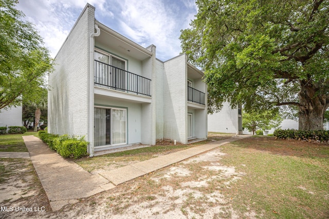 3230 Cumberland Rd Unit 18, Ocean Springs, MS 39564 - rear view of property featuring a balcony and stucco siding