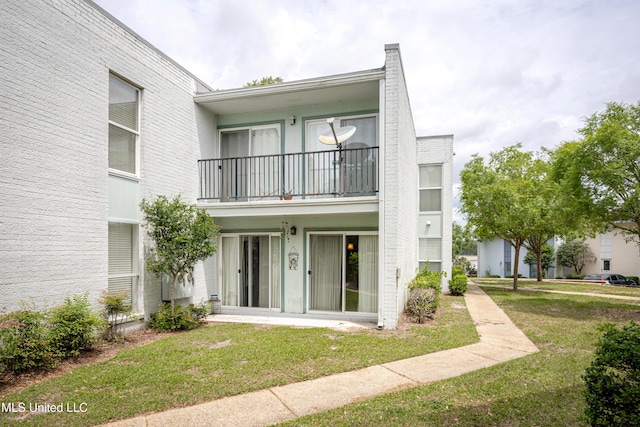 3230 Cumberland Rd Unit 18, Ocean Springs, MS 39564 - back of property with a yard and a balcony