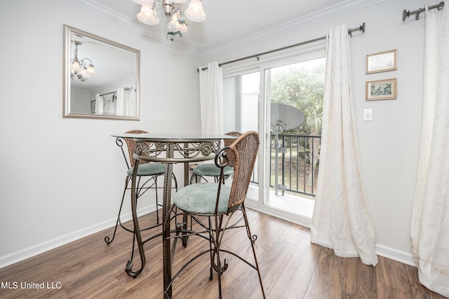 3230 Cumberland Rd Unit 18, Ocean Springs, MS 39564 - dining room featuring crown molding, baseboards, a notable chandelier, and wood finished floors