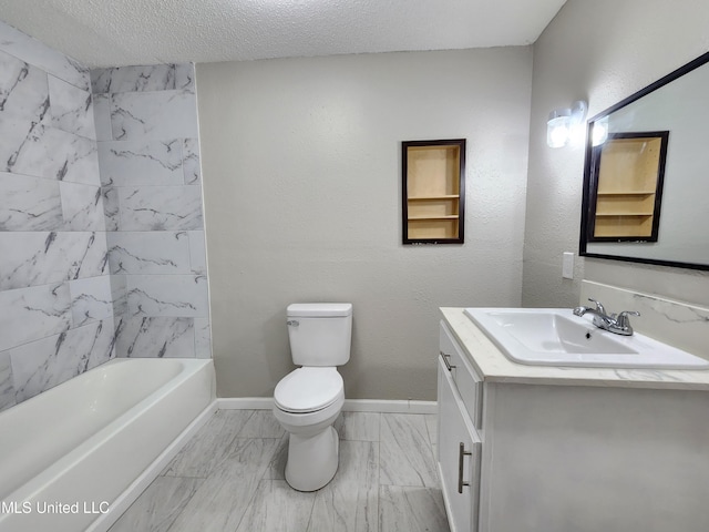 full bathroom featuring vanity, tiled shower / bath, a textured ceiling, and toilet