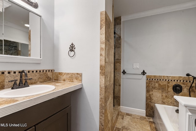 18401 Dogwood Ln, Saucier, MS 39574 - bathroom featuring ornamental molding, vanity, and a garden tub