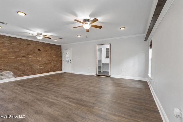 18401 Dogwood Ln, Saucier, MS 39574 - unfurnished living room featuring ornamental molding, a ceiling fan, brick wall, and dark wood finished floors