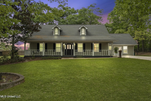 18401 Dogwood Ln, Saucier, MS 39574 - view of front of home featuring roof with shingles, covered porch, and a lawn
