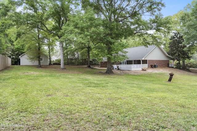18401 Dogwood Ln, Saucier, MS 39574 - view of yard with a sunroom and fence