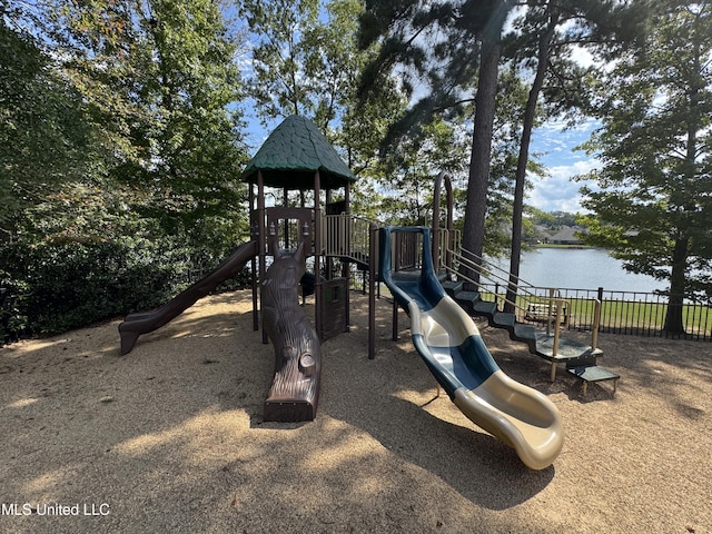 view of jungle gym featuring a water view