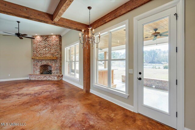 unfurnished living room featuring beam ceiling, concrete flooring, ceiling fan with notable chandelier, and a fireplace