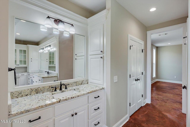 bathroom with concrete floors and vanity