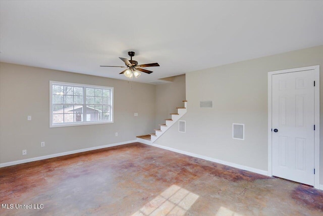 spare room with concrete floors and ceiling fan