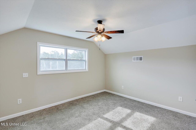 bonus room with ceiling fan, vaulted ceiling, and carpet flooring