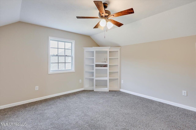 unfurnished bedroom featuring lofted ceiling, ceiling fan, and carpet flooring