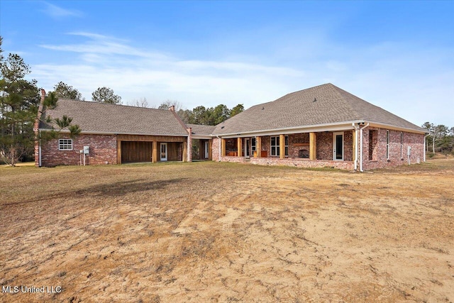 rear view of house with a lawn