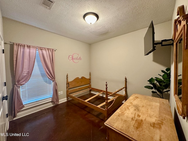 bedroom featuring a textured ceiling