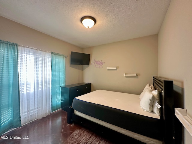 bedroom featuring a textured ceiling