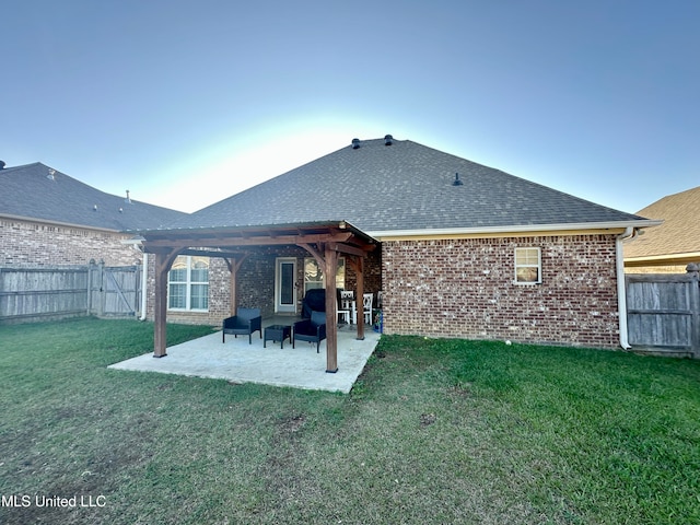 rear view of property with a patio area and a yard