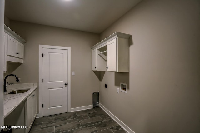 laundry room with sink, electric dryer hookup, cabinets, and hookup for a washing machine