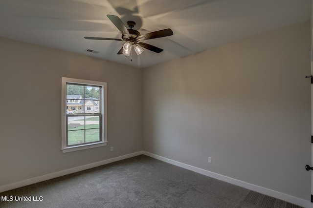 9070 Bennett Trl, Hernando, MS 38632 - empty room with dark carpet, baseboards, and a ceiling fan