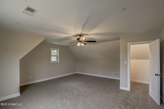 bonus room featuring lofted ceiling, carpet floors, and ceiling fan