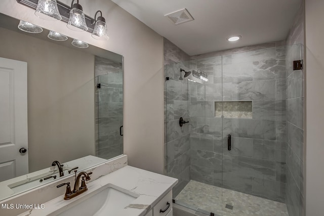 bathroom featuring vanity and walk in shower