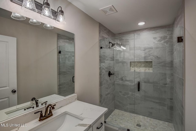 9070 Bennett Trl, Hernando, MS 38632 - bathroom with a stall shower, vanity, and recessed lighting